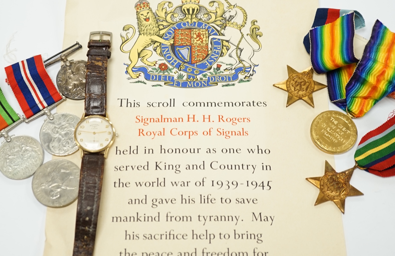 A WWII medal group awarded to Signalman H.H. Rogers, Royal Corps of Signals, comprising; a Pacific Star, a 1939-1945 Star, a Defence Medal and a 1939-1945 War Medal, together with the related note detailing the awards is